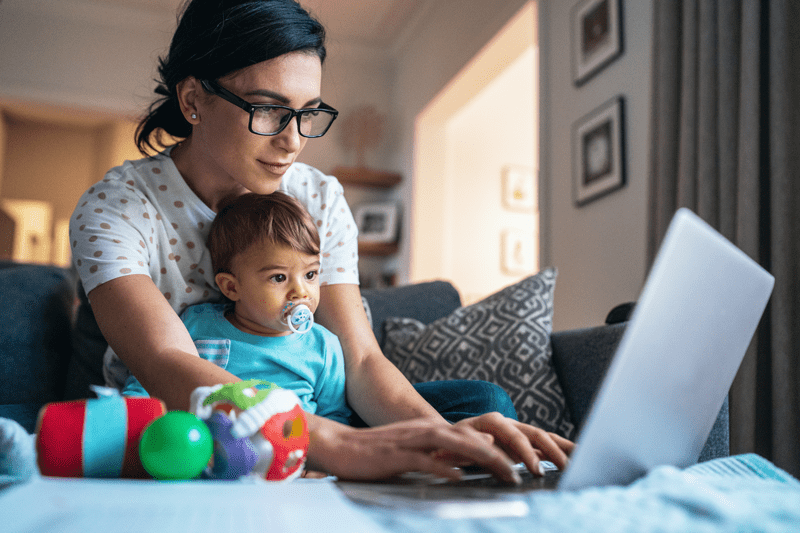 woman with baby at computer