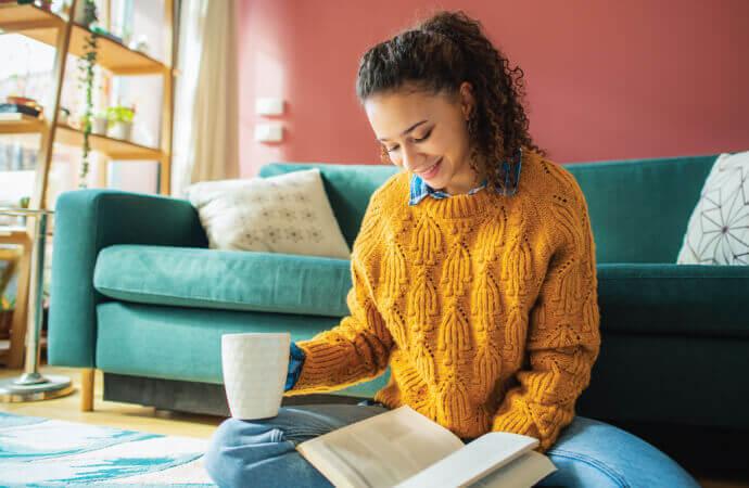 Woman with book and mug