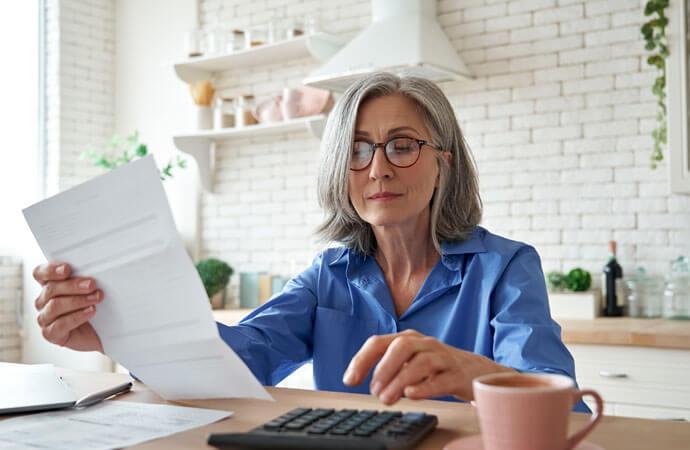 Woman with calculator and paper