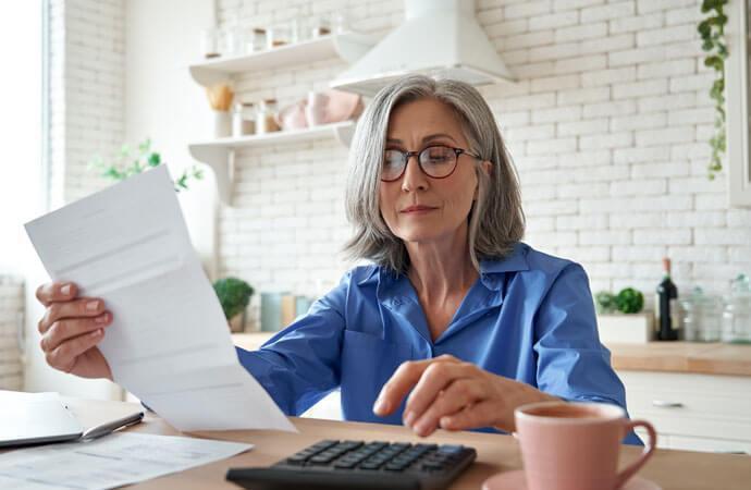 Mature White Woman with Calculator