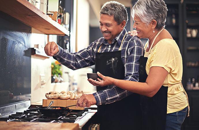 Mature couple cooking together