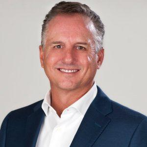 Well-dressed man cropped from the shoulders up.