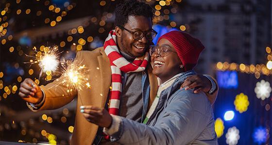 Couple holding sparklers
