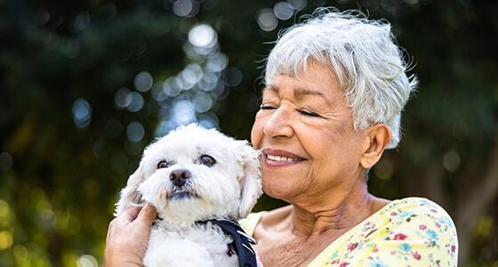 Mature woman holding dog
