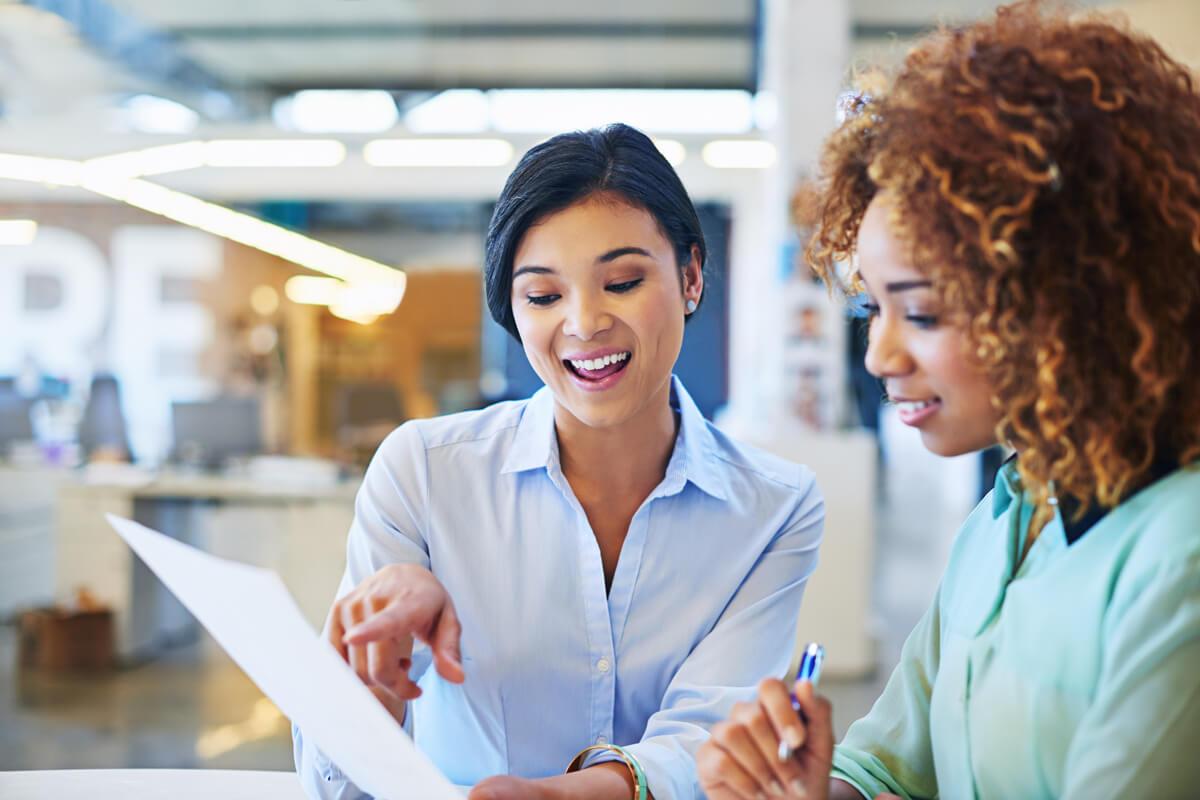 Women working on finance paper