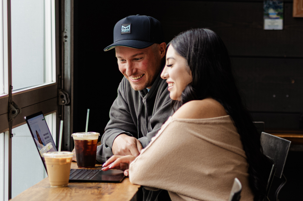 Couple in front of laptop