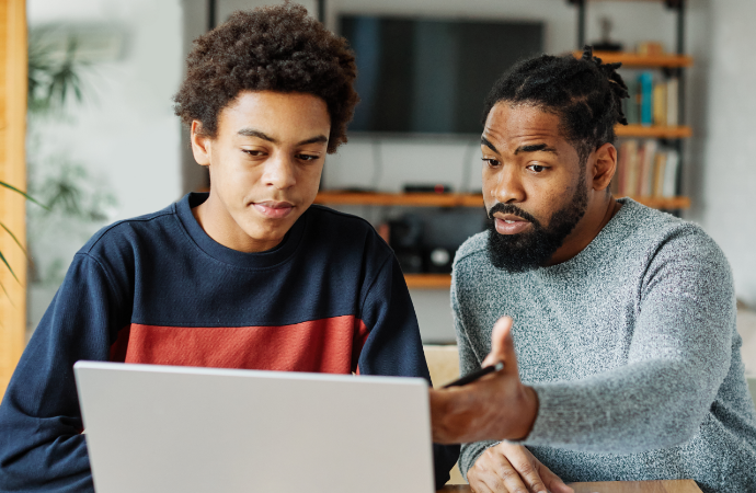 Father and son on laptop